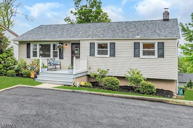 637 Bensel Dr, Mount Arlington Boro, NJ 07850 - view of front of property featuring a chimney and a shingled roof