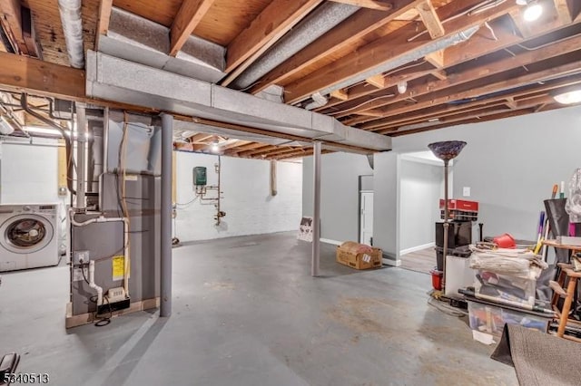 637 Bensel Dr, Mount Arlington Boro, NJ 07850 - unfinished below grade area featuring washer / clothes dryer and heating unit