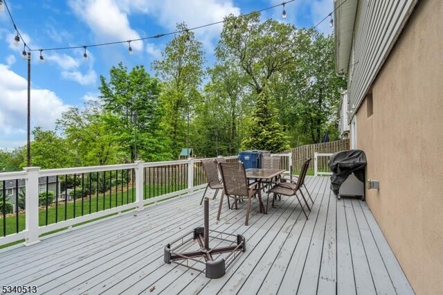 637 Bensel Dr, Mount Arlington Boro, NJ 07850 - wooden deck featuring outdoor dining area and area for grilling