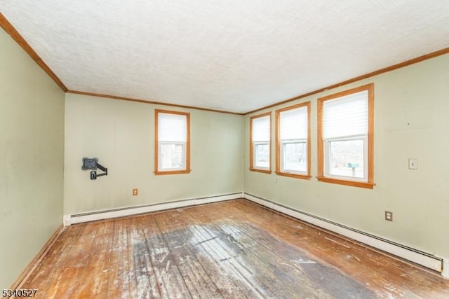 unfurnished room featuring a textured ceiling, wood-type flooring, crown molding, a baseboard radiator, and baseboard heating