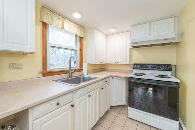 kitchen featuring white range with electric cooktop, under cabinet range hood, light countertops, white cabinets, and a sink