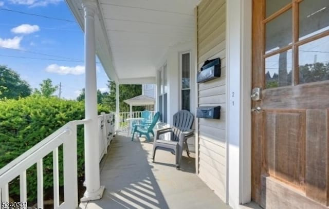 balcony featuring a porch