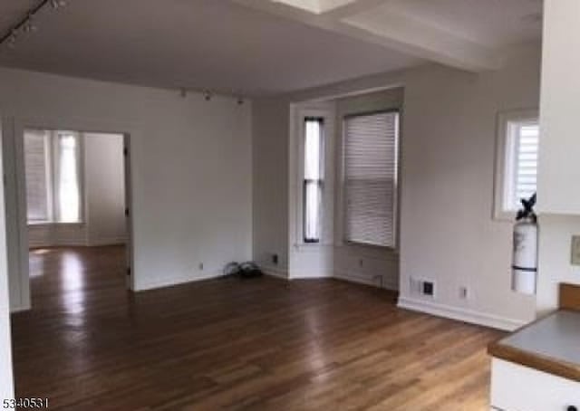 unfurnished living room with wood finished floors