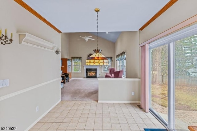 unfurnished living room with a warm lit fireplace, high vaulted ceiling, light tile patterned flooring, light carpet, and baseboards