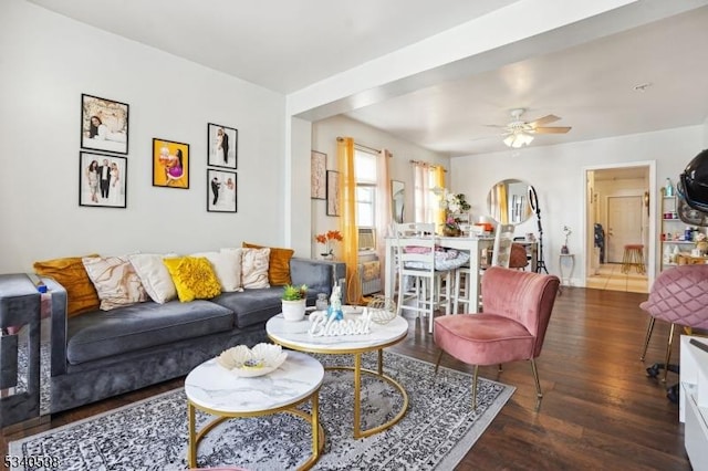 living area featuring wood finished floors and a ceiling fan