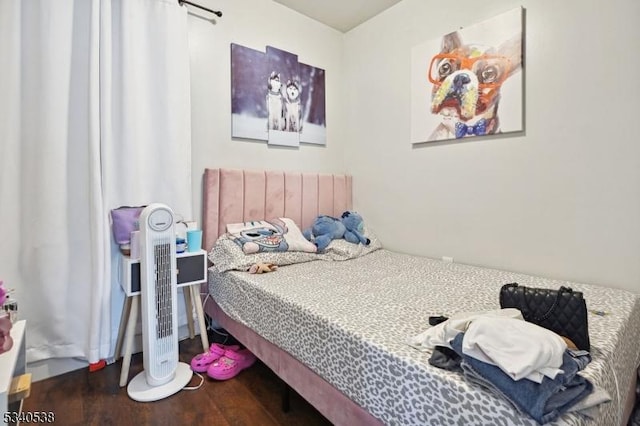 bedroom with wood finished floors