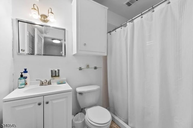 bathroom with toilet, curtained shower, visible vents, and vanity