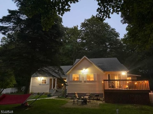 back of property featuring a patio and a lawn