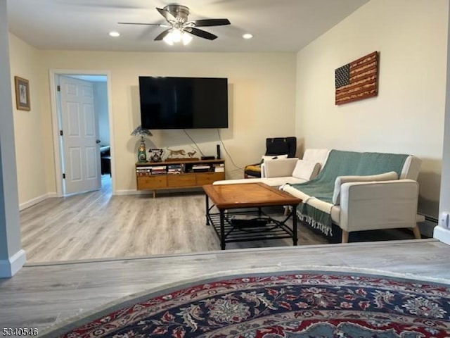 living room with ceiling fan, recessed lighting, wood finished floors, and baseboards