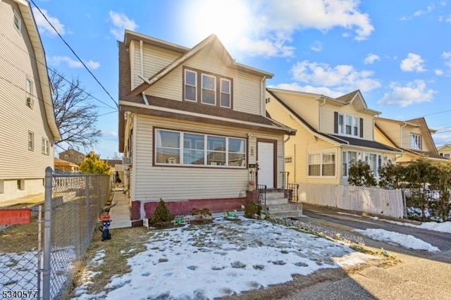 view of front of home featuring fence