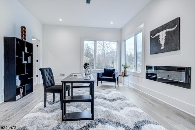 office with baseboards, wood finished floors, visible vents, and recessed lighting