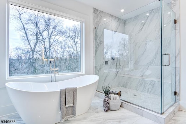 full bathroom with a soaking tub, a marble finish shower, marble finish floor, and recessed lighting