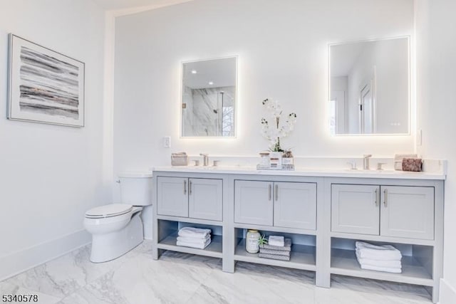 bathroom with double vanity, a marble finish shower, toilet, marble finish floor, and a sink