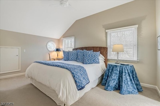 bedroom featuring lofted ceiling, a ceiling fan, baseboards, and carpet flooring