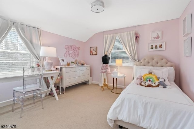 bedroom featuring lofted ceiling, baseboards, and light colored carpet