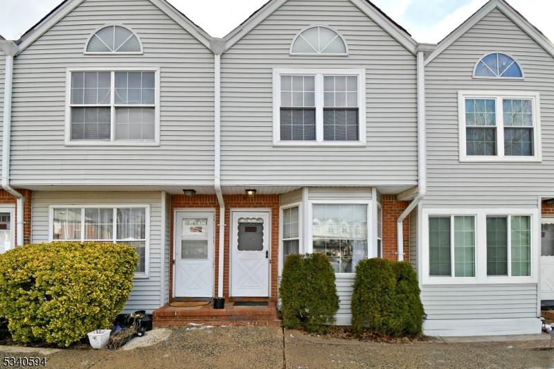 multi unit property with entry steps and brick siding