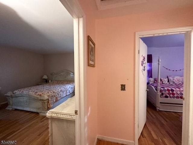 bedroom with wood finished floors