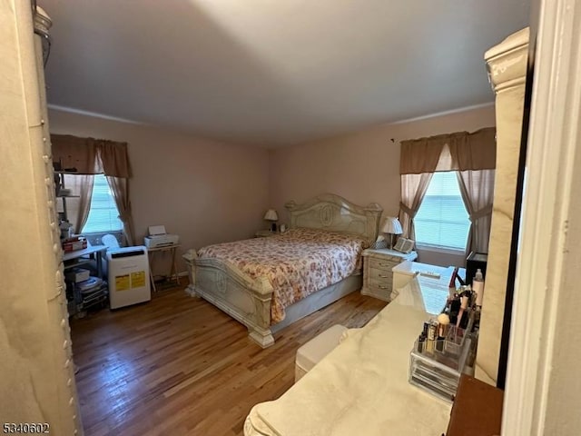 bedroom with light wood finished floors