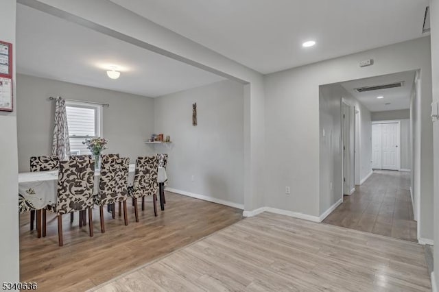 dining space featuring recessed lighting, visible vents, baseboards, and wood finished floors