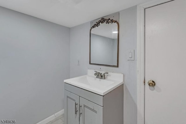 bathroom with vanity and baseboards