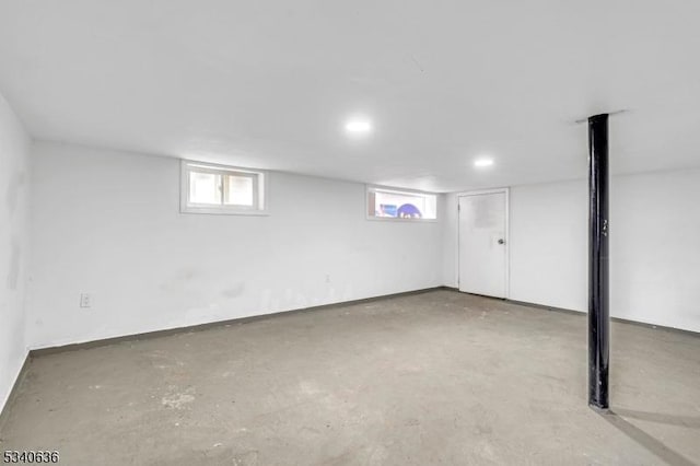 basement with a healthy amount of sunlight and baseboards