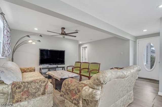 living room featuring a ceiling fan, recessed lighting, and wood finished floors