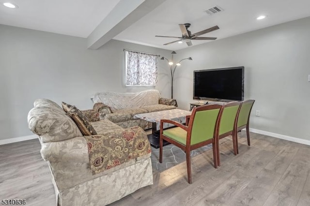 living room featuring baseboards, visible vents, a ceiling fan, wood finished floors, and recessed lighting