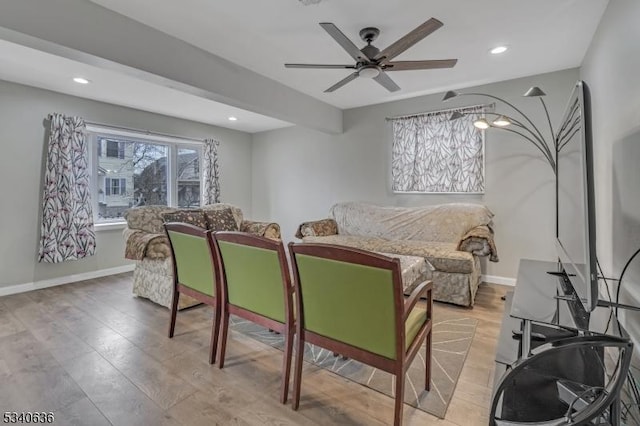 living room with recessed lighting, wood finished floors, a ceiling fan, and baseboards