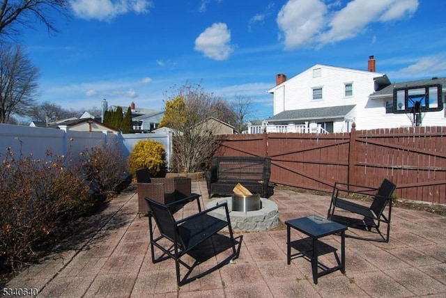 view of patio / terrace featuring a fenced backyard and a fire pit