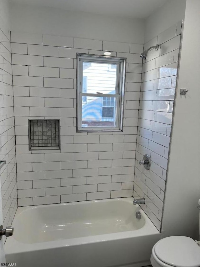 full bathroom featuring toilet and shower / bathtub combination