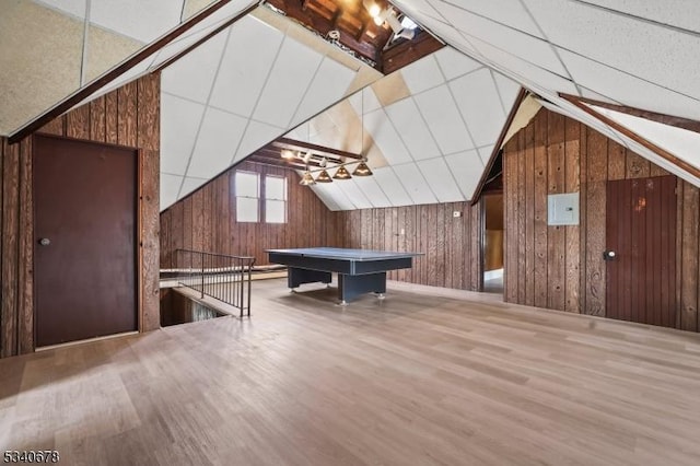 playroom featuring vaulted ceiling, pool table, wood walls, and wood finished floors