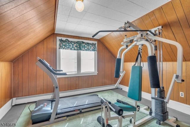 exercise area with lofted ceiling, wood walls, and carpet