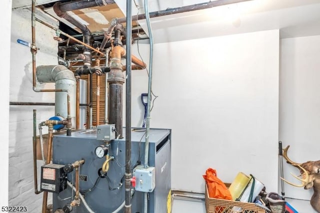 utility room featuring a heating unit