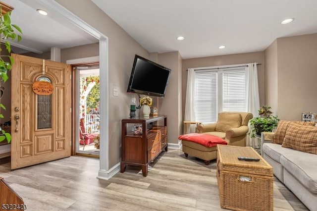 interior space with light wood-style flooring, a wealth of natural light, and recessed lighting