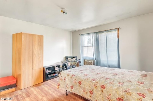 bedroom with light wood-style floors