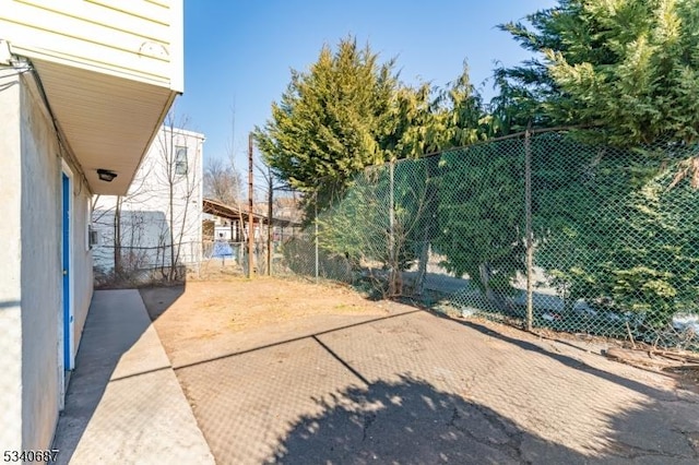 view of yard with fence and a patio