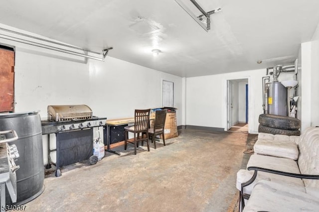 interior space featuring a garage, water heater, and unfinished concrete flooring