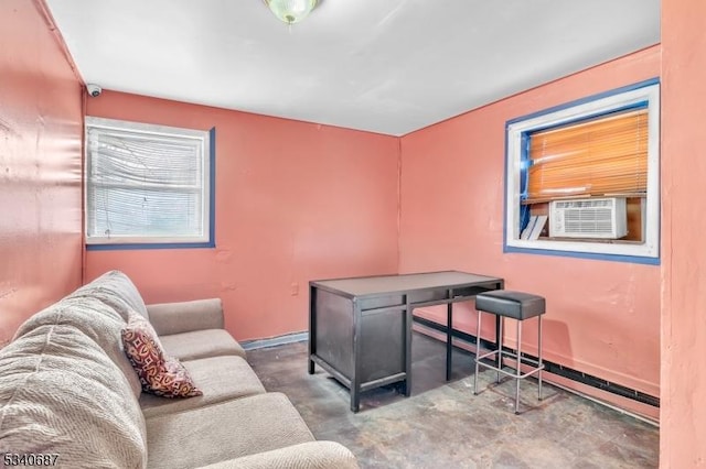 office area with a baseboard heating unit, cooling unit, and concrete floors