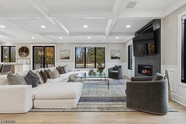 living room featuring a fireplace, coffered ceiling, beam ceiling, and recessed lighting