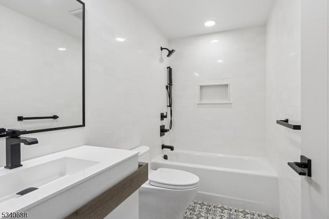 full bathroom with toilet, a sink, and shower / bathing tub combination