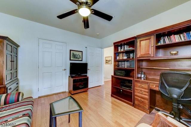 office featuring light wood-type flooring and a ceiling fan