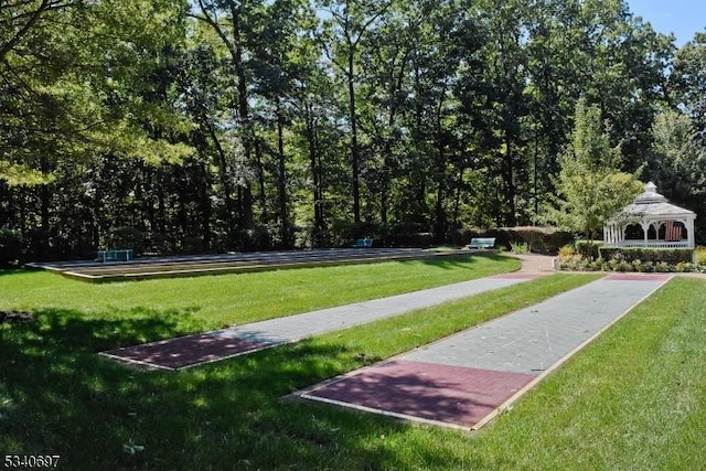 view of community with a lawn and a gazebo