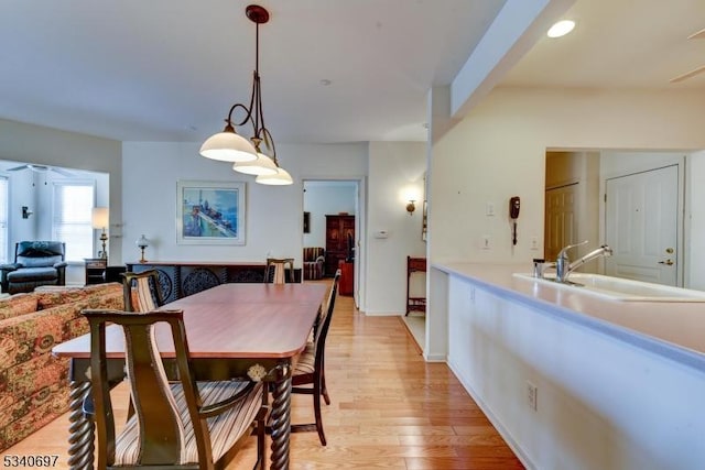 dining space with light wood-style floors