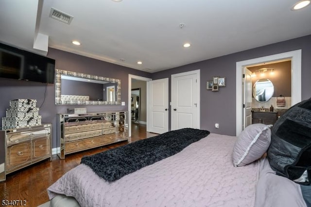 bedroom featuring dark wood-style floors, recessed lighting, and visible vents