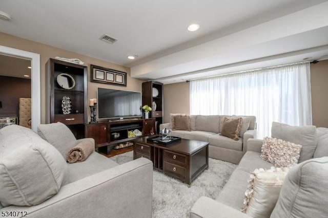 living room with recessed lighting and visible vents