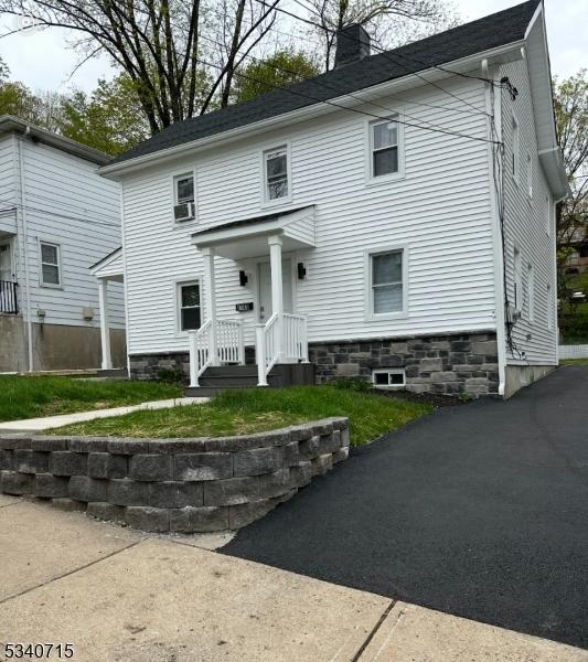 colonial home featuring a chimney