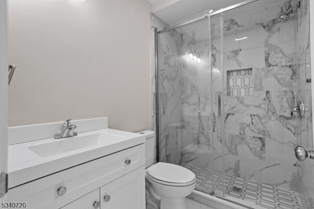 full bath with marble finish floor, a marble finish shower, vanity, and toilet