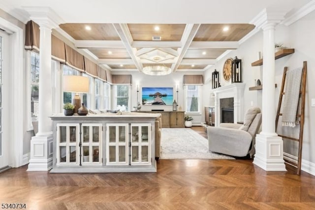 interior space featuring recessed lighting, a fireplace, and ornate columns