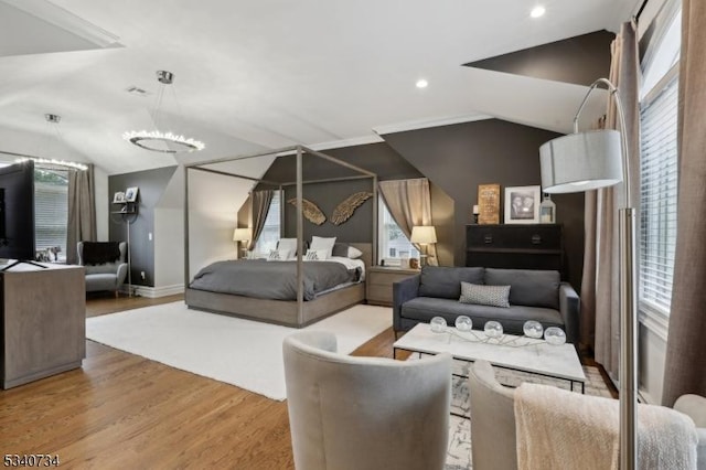 bedroom with lofted ceiling, baseboards, wood finished floors, and recessed lighting