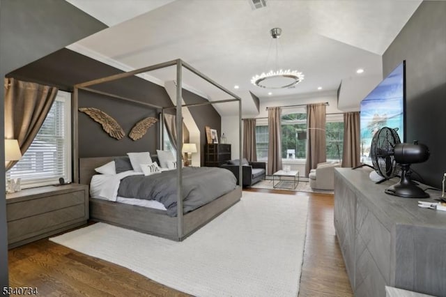 bedroom with wood finished floors and recessed lighting